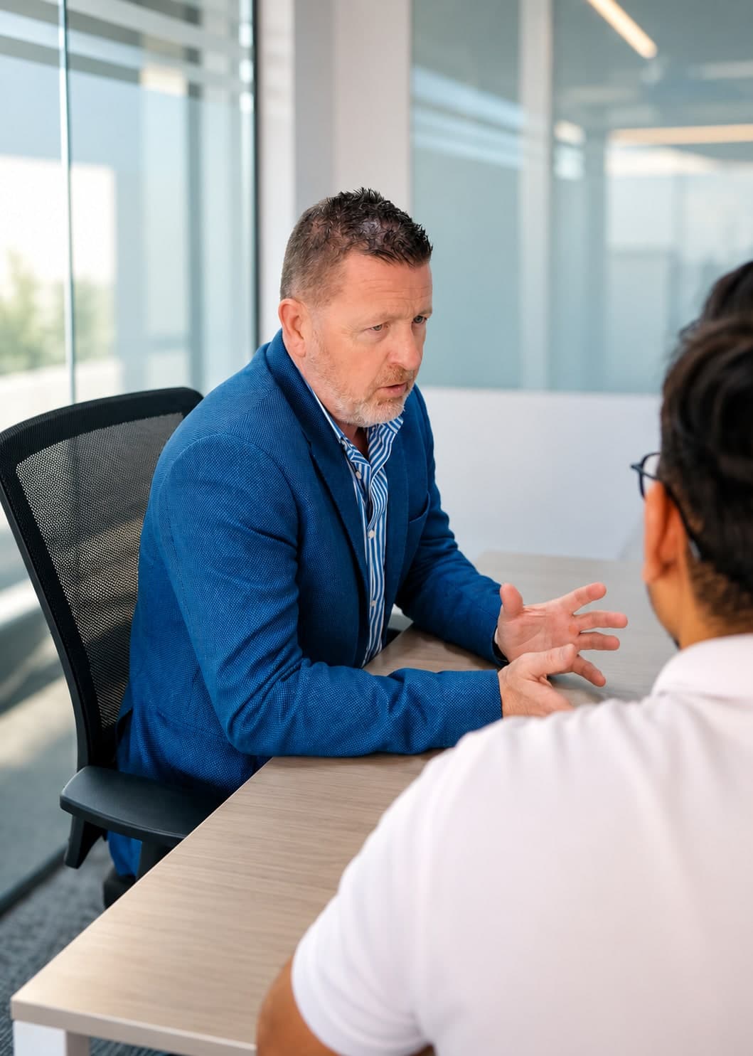 John Nolan in a focused one-to-one coaching conversation